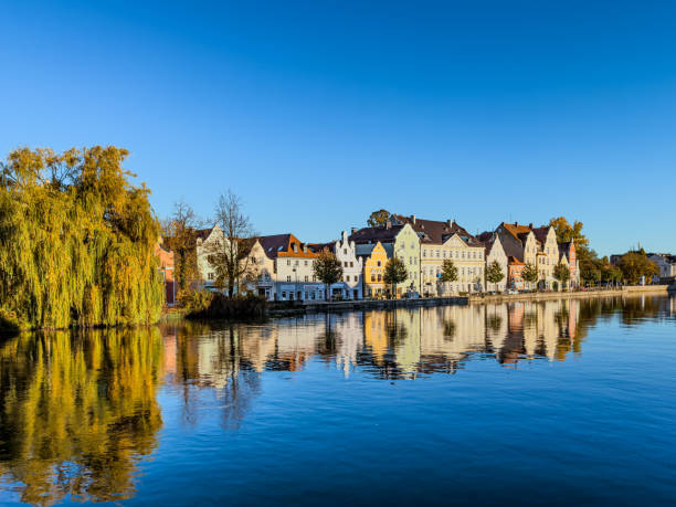 istock Houses reflecting on water 1791757994
