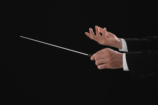 istock Professional conductor with baton on black background, closeup 1791760082