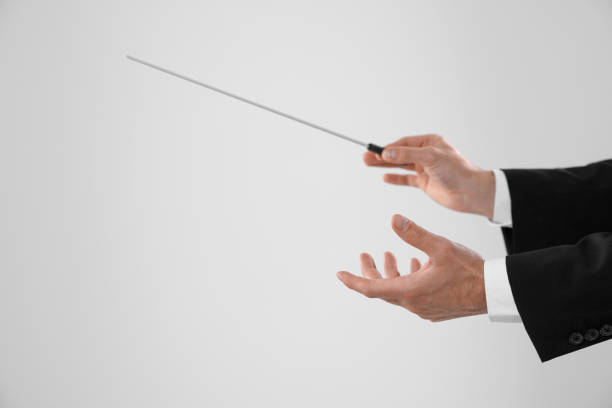 istock Professional conductor with baton on light grey background, closeup. Space for text 1791760126
