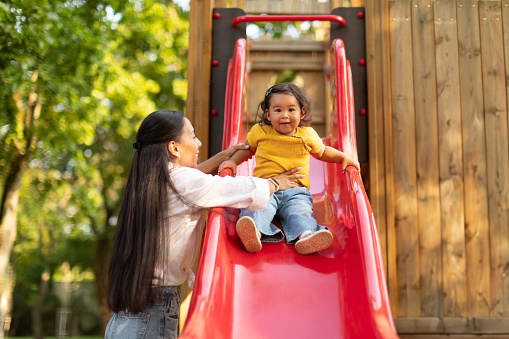 Portrait of a girl student a having fun on playground at school