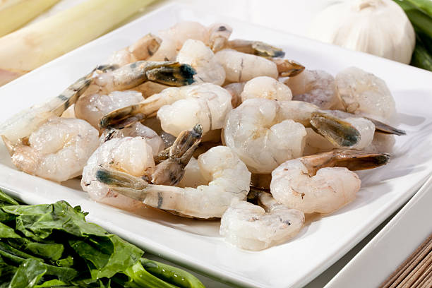 Close up of a pile of cooked,steamed and peeled shrimp being served as an appetizer