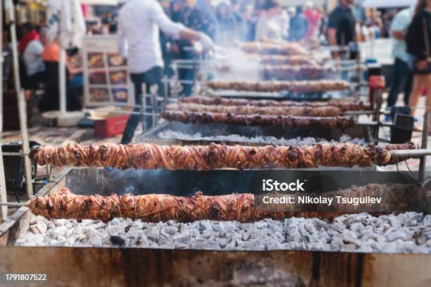 Easter In Greece Process Of Cooking Traditional Greek Easter Dish Grilled Kokoretsi A Lamb Or Goat Intestines And Offal Grilling Kokoreç In The Streets Of Athens Greece Roasted Kokorec Rolls Stock Photo - Download Image Now