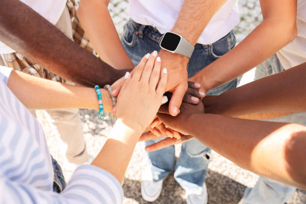 istock Multicultural people holding hands on top each other, cropped 1791811806