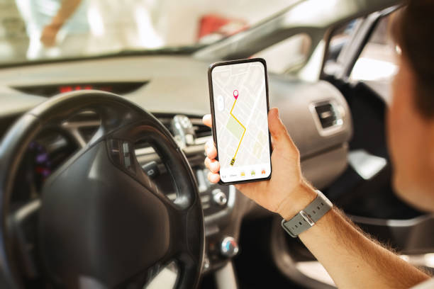istock Man driver holding mobile phone with map gps navigation 1791811845