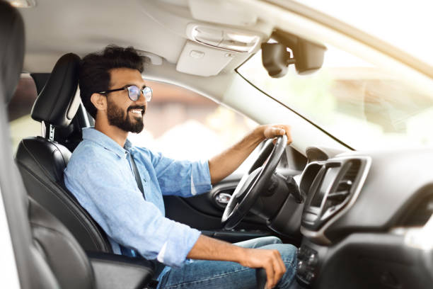 istock Positive handsome eastern man enjoying his new auto 1791837744