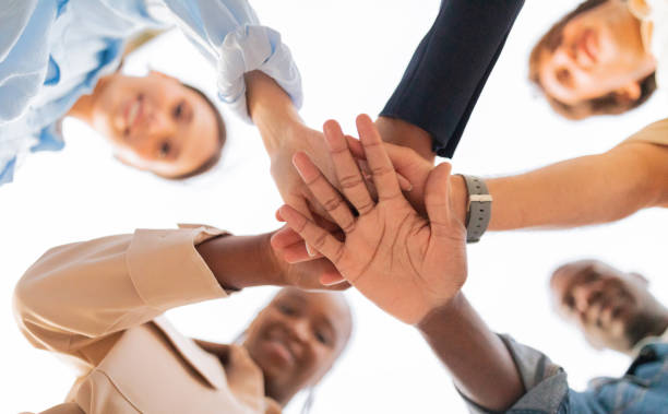 istock Happy multiethnic young friends holding hands together 1791850387
