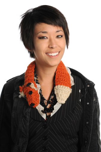 Portrait of Asian American woman smiling isolated over white background