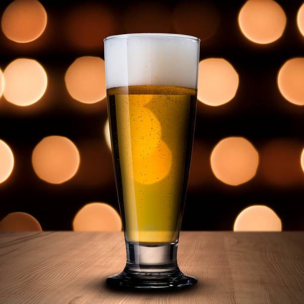 istock Glass of cold beer on wood table 179189866