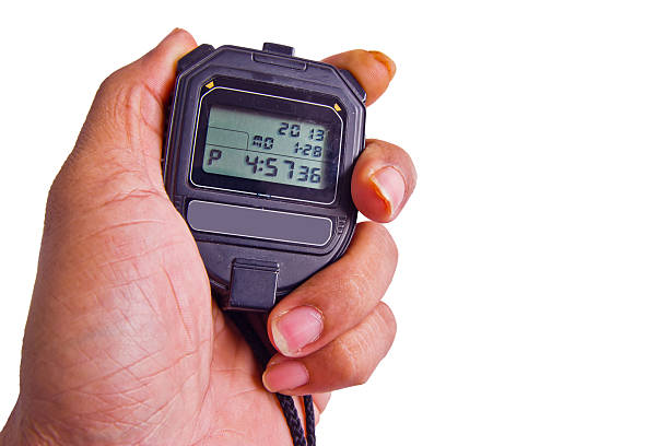 istock hand holding stopwatch against  abstract background 179189989