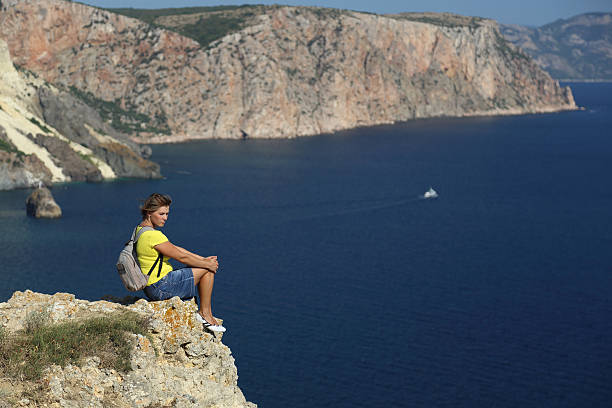 istock young woman and a beautiful seascape 179190537