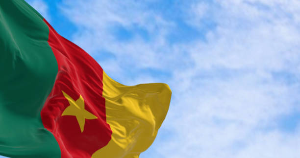 istock Cameroonian flag fluttering against a clear blue sky 1791908684