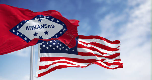 istock Arkansas and US flags in unison against sky 1791909758