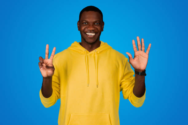 istock Smiling happy young black guy show two and five fingers, seven gesture 1791909784