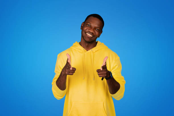 istock Cheerful young black man point fingers at camera, motivating for work, study 1791909787