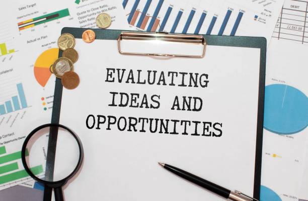 istock Evaluating business opportunities word printed on a book. Business concept 1791914486