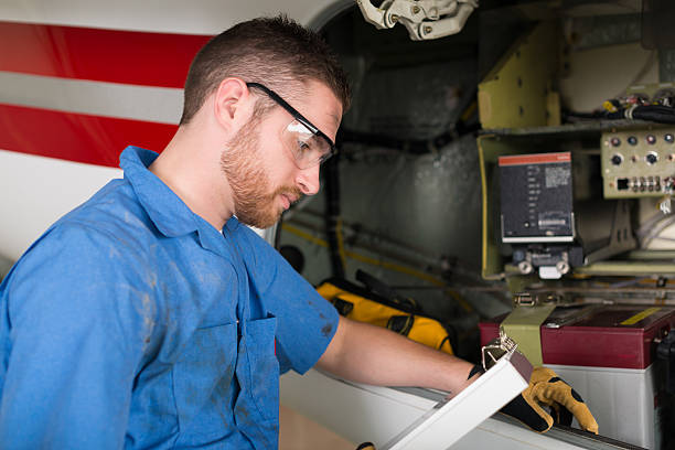 istock Airplane mechanic working on engine of private jet 179194398
