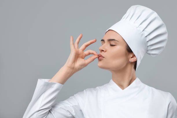 istock Female chef showing perfect sign on light grey background 1791946695