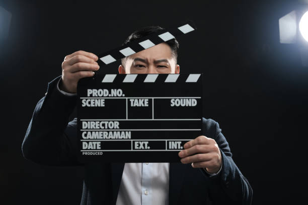 istock Asian actor with clapperboard on stage. Film industry 1791950343
