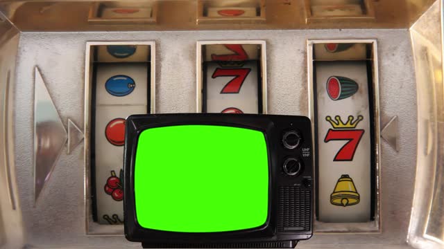 Slot Machine and Vintage Television Turning On Green Screen. 4K Resolution.