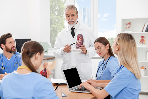 Doctor giving lecture for interns in university