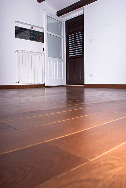 istock room with hardwood floors 179204840