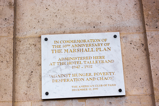 Paris, France: A marble plaque commemorating the 50th anniversary of the Marshall Plan. The plaque hangs on the wall of the Hotel de Talleyrand, a grand palace near the Place de la Concorde that belongs to the American Embassy in Paris.