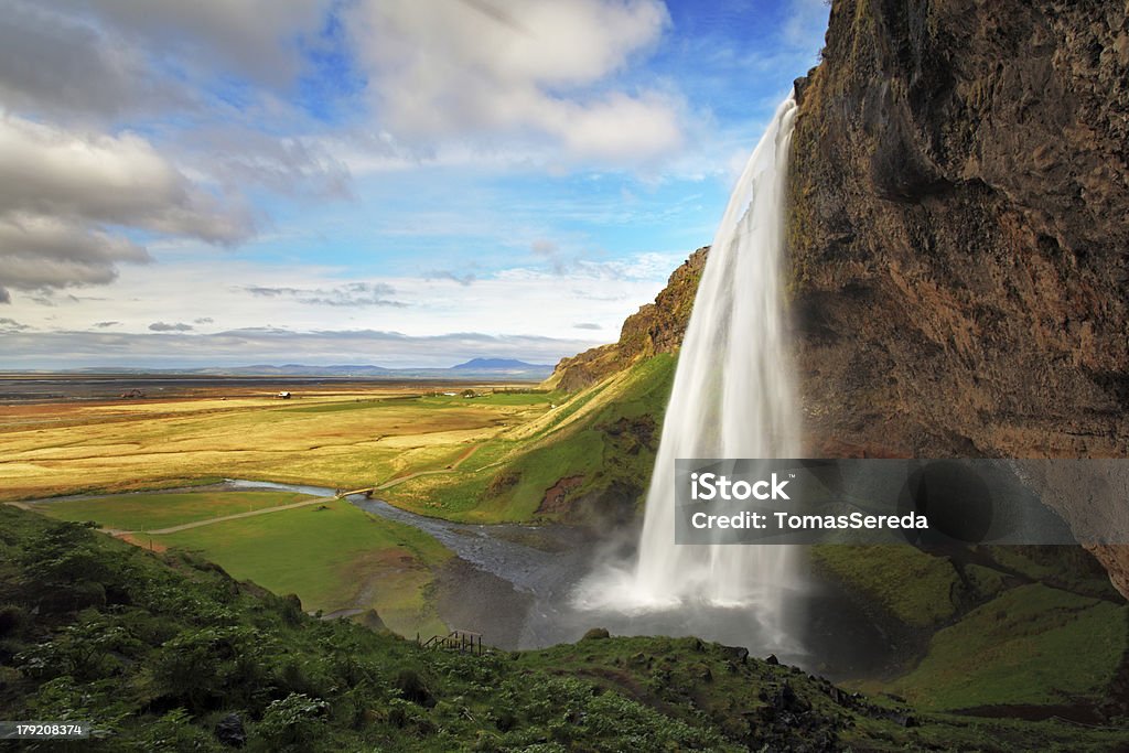 Waterfall in Iceland - Seljalandsfoss Seljalandsfoss is one of the most beautiful waterfalls on the Iceland. It is located on the South of the island. With a rainbow. Beauty In Nature Stock Photo