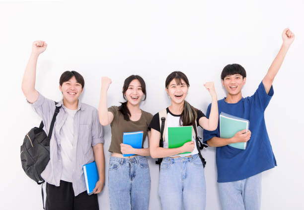 Group of stylish students on white background