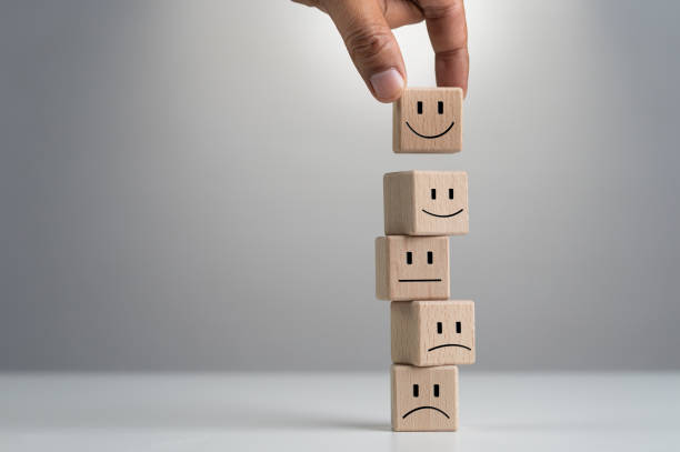 istock customer satisfaction survey feedback and ratings for business success, customer hand selects wooden cube with happy smiley face icon, excellence rating to service experience, best service. 1792086234