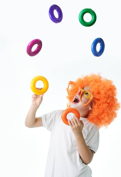 Cute funny clown child on white background stock photo