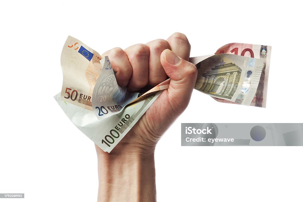 Euro bills in male fist Fist holding european currency bills European Union Currency Stock Photo