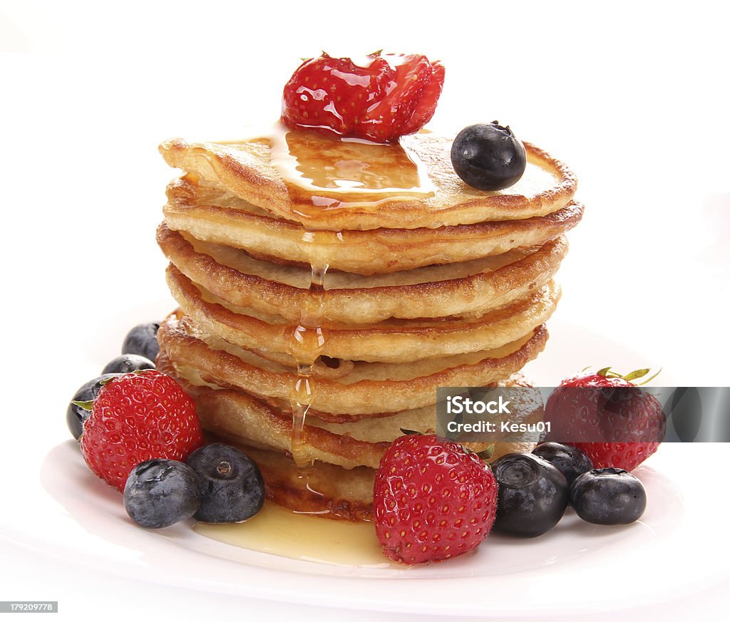 Delicious pancakes stack Delicious pancakes stack with fresh fruits Berry Fruit Stock Photo