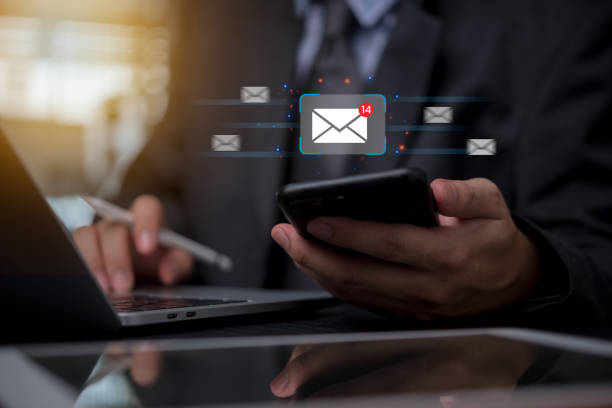 istock Businessman holding mobile phone icon email send digital technology marketing message communications and invite contact online electronic newsletter. 1792103800