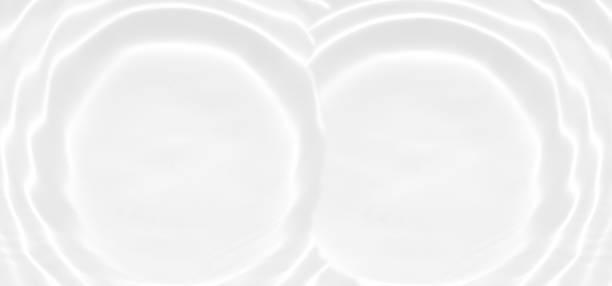 istock White water with ripples on the surface. Defocus blurred transparent white colored clear calm water surface texture with splashes and bubbles. Water waves with shining pattern texture background. 1792119698