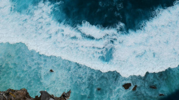 istock Turquoise ocean sea water white wave pattern splashing deep blue sea. Seascape dark ocean background wave splash on rock. Tropical sea beach in summer seaside outdoor. Water Surface blue wave pattern 1792119983