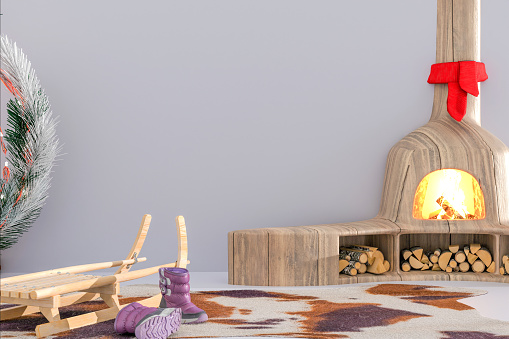 Bedroom interior with winter holiday decor with fireplace, sleigh, and winter boots on a light gray wall background with bluish hues and copy space. Winter vacations. 3d render.