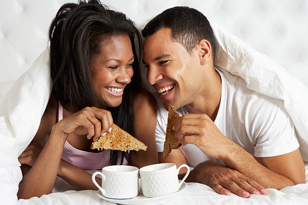 istock Couple Enjoying Breakfast In Bed 179212680