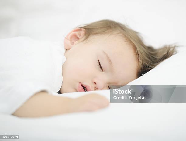 Baby Sleeping On White Bed Stock Photo - Download Image Now - 12-17 Months, Babies Only, Baby - Human Age