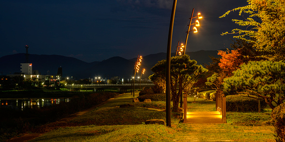 Gyeongju City Sunrise Landscape at dawn at Footbridge over Nam Chon or South River, illuminated by the golden street lights in South Korea