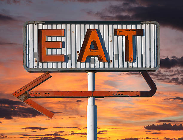 istock Vintage Eat Arrow Sign with Sunset Sky 179213098