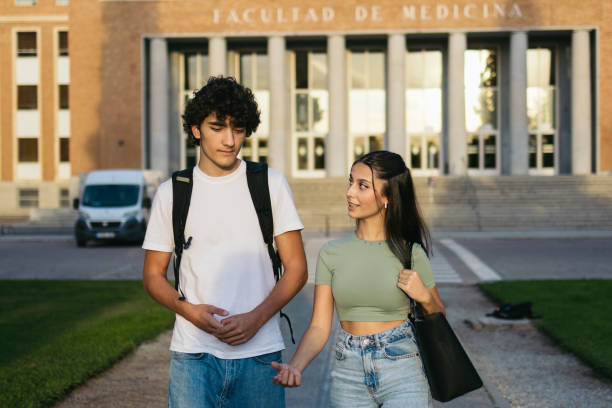 istock Pair of students college leaving the university. 1792134464