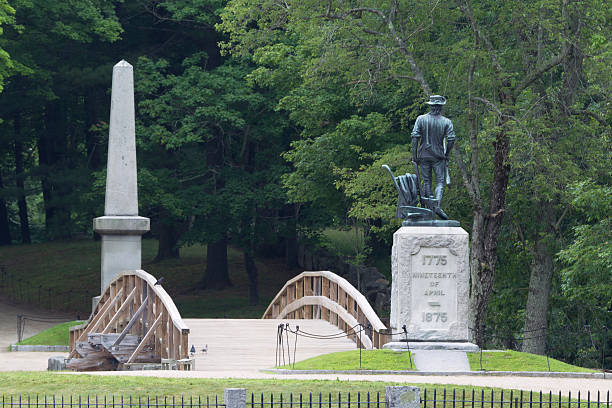 Minuteman Statue, North Bridge and Monument Minuteman Statue, North Bridge and Monument at Concord, MA.Here, on the 19 of April 1775 was made the first forcible resistance to British aggression on the opposite bank stood the American Army and on this spot the first of the Enemy fell in the war of the Revolution which gave independence to these United State in gratitude to God and in the love of freedom. concord massachusetts stock pictures, royalty-free photos & images