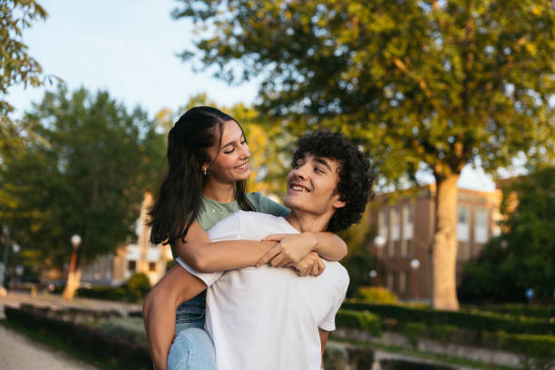 istock Pair of cute college students outdoors at university 1792139259