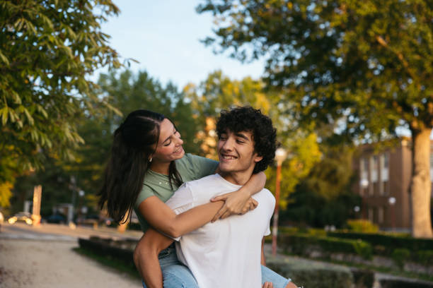 istock Pair of cute college students outdoors at university 1792139276