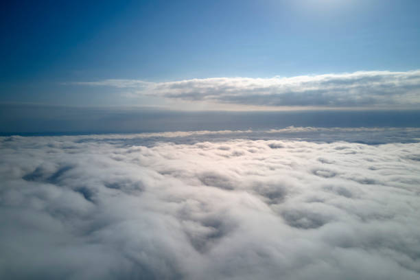 istock Aerial view from high altitude of earth covered with puffy rainy clouds forming before rainstorm 1792139812