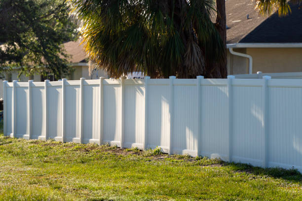 istock White plastic fence for back yard protection and privacy 1792140386