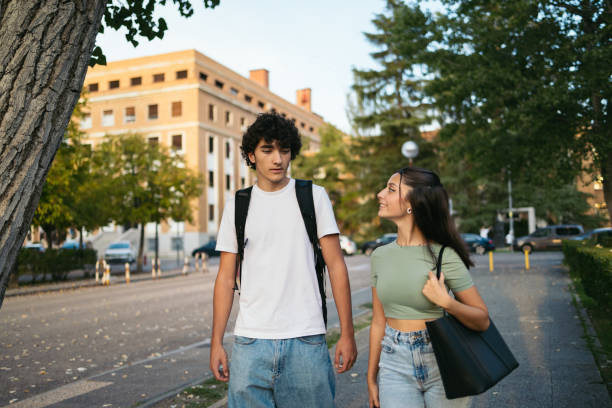 istock Pair of students college leaving the university. 1792142007