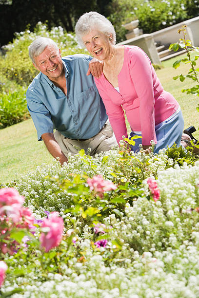 istock Senior couple working in garden 179214216