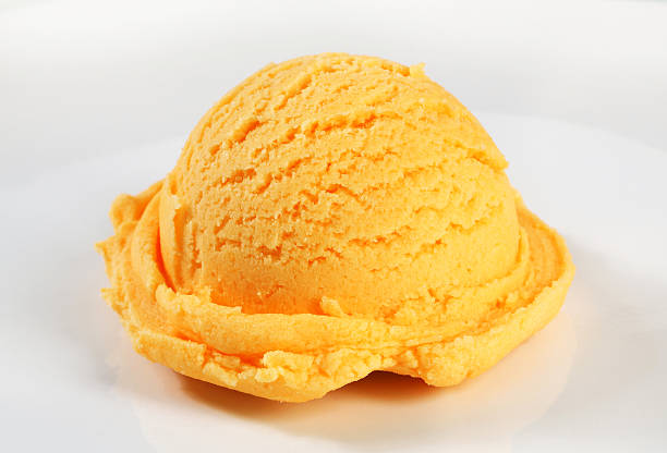 istock Scoop of orange sherbet on a white dish 179214401