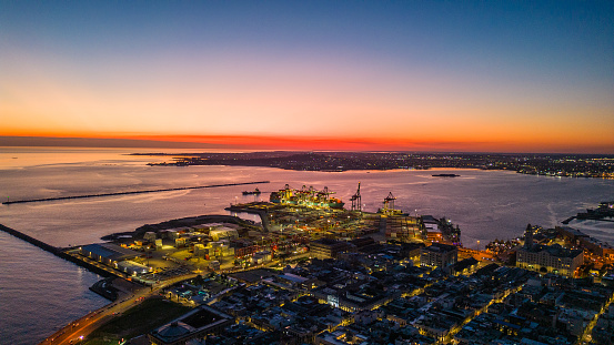 Montevideo city and port in the background at sunset